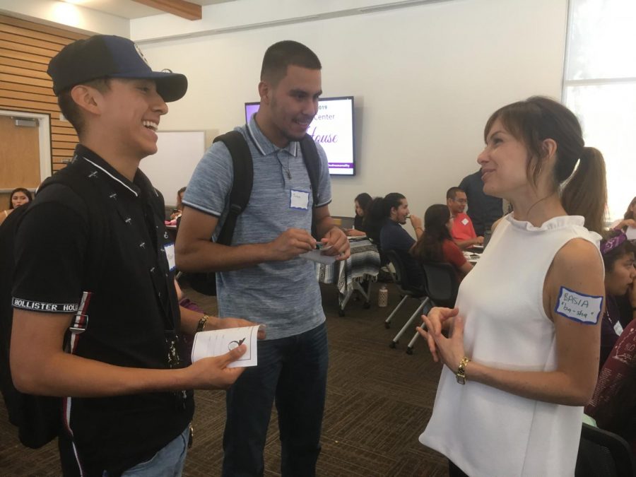 Marcos Perez, left, a business sophomore, and Juan Zamudio, middle, a mechanical engineering freshman, meet Basia Ellis. Ellis, a Sac State assistant child development professor, produced a webinar, Addressing the Undocumented Stress Cycle.