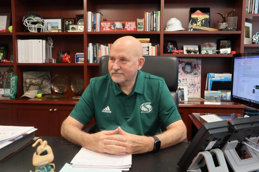 Robert Nelsen, president of Sacramento State, sits in his office in Sacramento Hall on Sept. 6. Nelsen regularly attends the universitys athletic events.