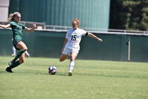 Sac State senior midfielder Mikayla Reed prepares to kick the ball against Cal Poly on Sunday, Aug. 25 at Hornet Field. The Hornets defeated the Mustangs 3-1.