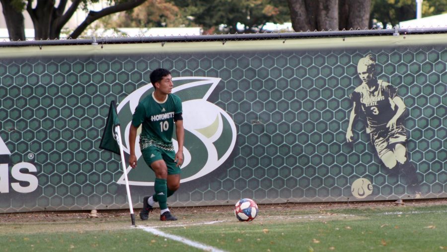 Sac State sophomore midfielder Oscar Govea takes a corner kick against Cal State Fullerton Saturday, Oct. 19 at Hornet Field. The Hornets lost to the Titans in overtime 2-1.