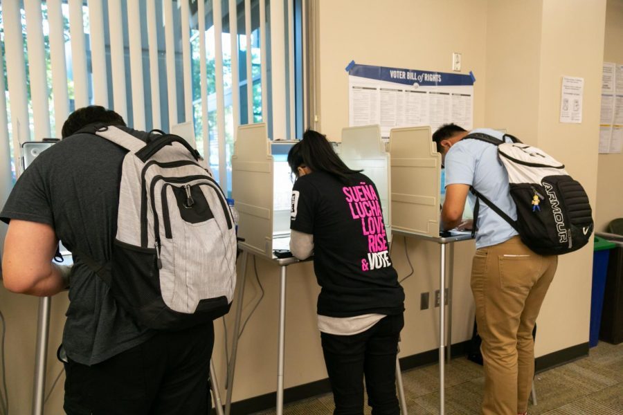 Voters cast their ballots at the vote center in Modoc Hall Tuesday, Nov. 6, 2018. Gov. Gavin Newsom recently signed Assembly Bill 59 which prioritizes placing vote centers on college campuses.