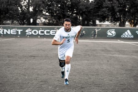 Sac State senior defender Mac Harrington runs toward the camera in this photo illustration Thursday, Sept 19, after a game against the University of San Francisco. Harrington is coming back from a torn ACL that prematurely ended his junior season Sept. 29, 2018.