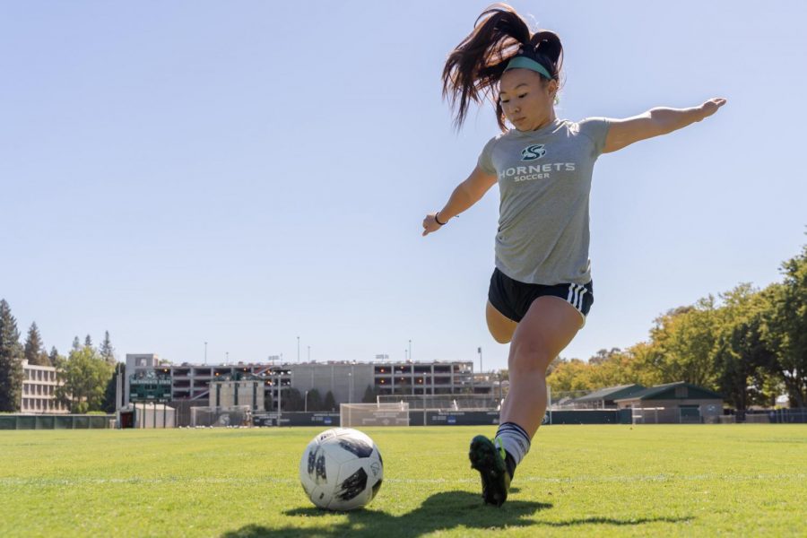 Sac State junior forward Kylee Kim-Bustillos kicks the ball at practice Tuesday, Sept. 24 at Hornet Field. Kim-Bustillos has scored 7 goals and made 3 assists thus far in the 2019 season.