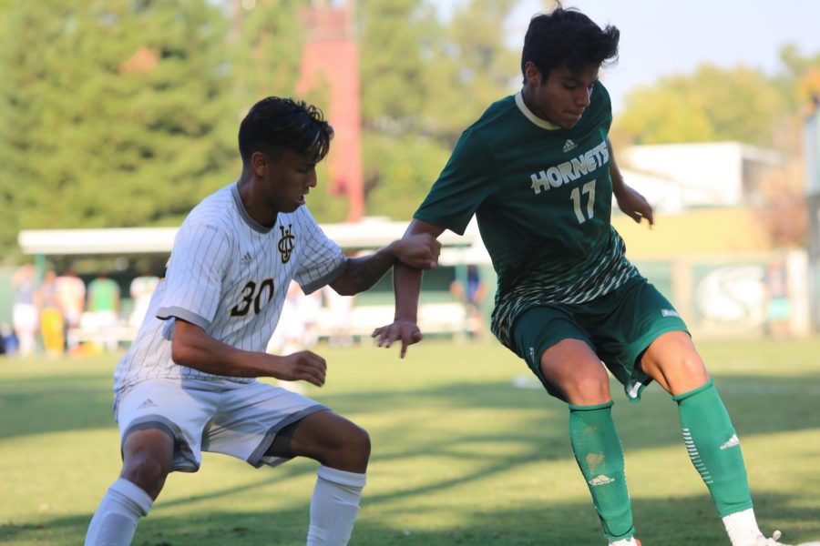 Sac State sophomore defender Alejandro Alacantaro battles for possession of the ball with UC Irvine freshman midfielder Roberto Molina Saturday Oct. 12 at Hornet Field. UC Irvine and Sac State played a 2-2 draw.