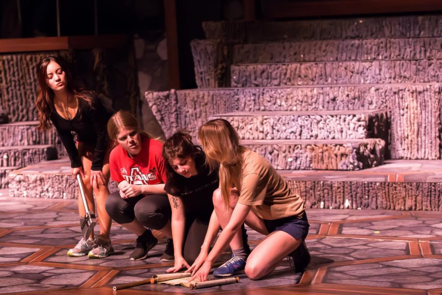 From left to right: Scarlett Pascoal (Lilith), Ana Muntean (Agnes), Nicole Kelly (Tilly) and Dagney Hollmann (the dark elf) rehearse scenes of the show Oct. 16. The center of the stage is painted to resemble a Dungeons and Dragons campaign board.