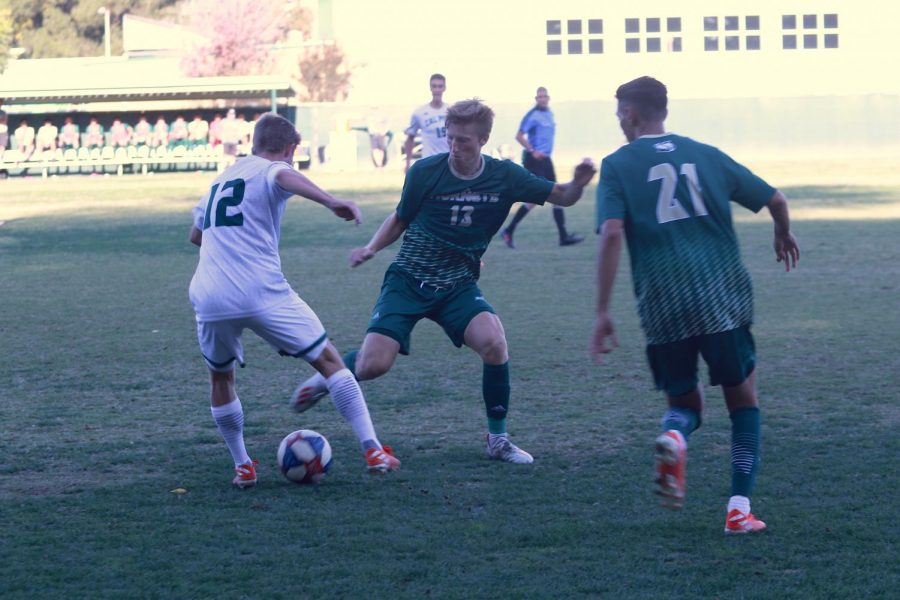 Sac State senior midfielder Matt Carnefix attempts to steal the ball from Cal Poly junior midfielder Kenneth Higgins against the Mustangs Wednesday, Oct. 23 at Hornet Field. Carnefix attempted one shot in the loss.