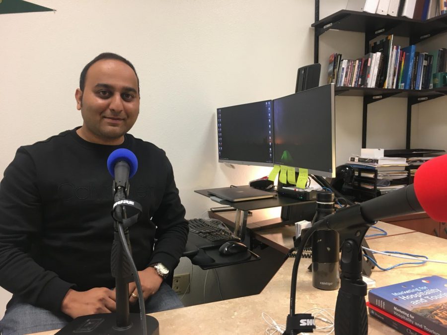 Professor of Hospitality and Tourism Abhijeet Shirsat in his office with getting ready for The State Hornet News Podcast. Shirsat's dissertation focused on fake news and its spread on social media.