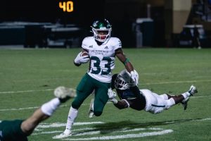 Sacramento State junior running back Elijah Dotson breaks a tackle against Cal Poly Oct. 26 at Alex G. Spanos Stadium. The Hornets defeated the Mustangs 38-14 Saturday night.