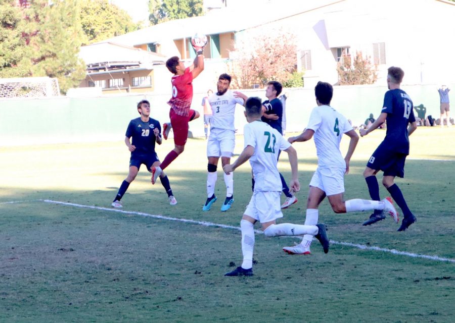 Sac State junior goalkeeper Hector Grajeda makes a save against UC Davis Saturday Oct. 5 at Hornet Field. UC Davis went on to win 2-1 in overtime.