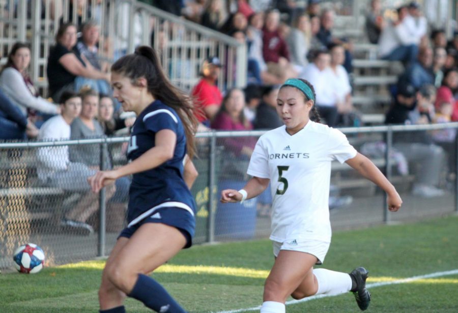 Sac State junior forward Kylee Kim-Bustillos attempts to steal the ball against Northern Arizona Friday, Oct. 4 at Hornet Field. Kim-Bustillos scored one goal in the Hornets 3-0 win against Southern Utah Sunday.