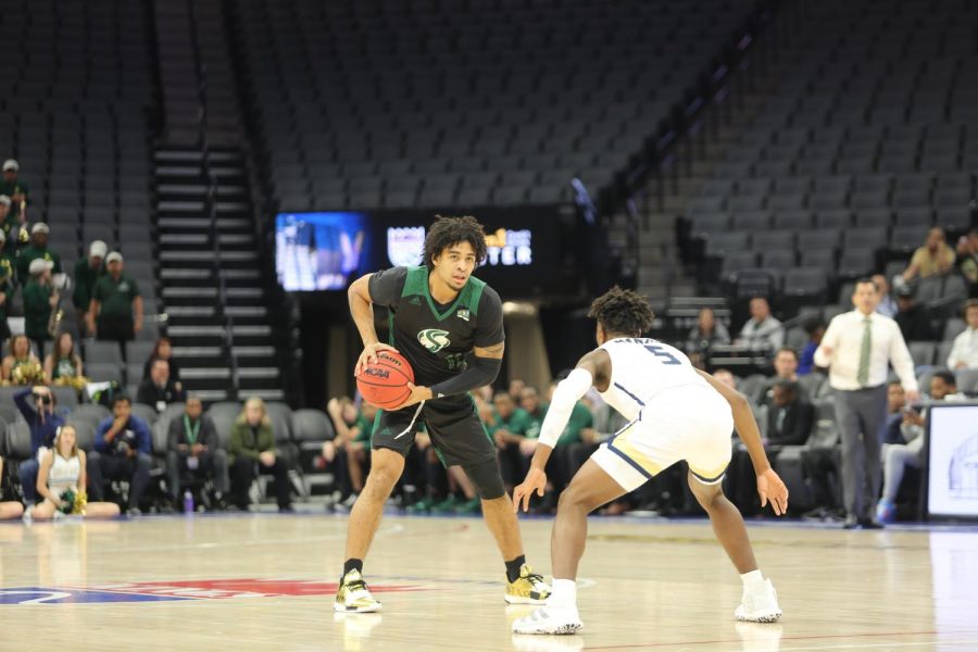 Sac State sophomore guard Brandon Davis pivots while being guarded by UC Davis freshman guard Ezra Manjon on Wednesday, Nov. 20 at Golden 1 Center. The Hornets lost their first game of the season Saturday night 59-45 at No. 21 Colorado.