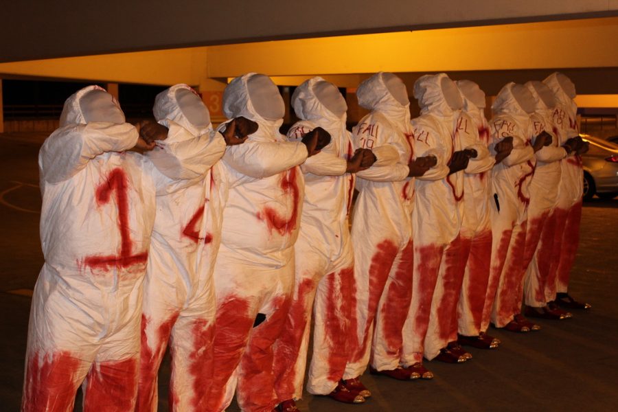 The newest line of Kappa Alpha Psi members stand prepared for their reveal an hour before their performance Nov. 22. A line in a Greek organization is the group of people joining at the same time.