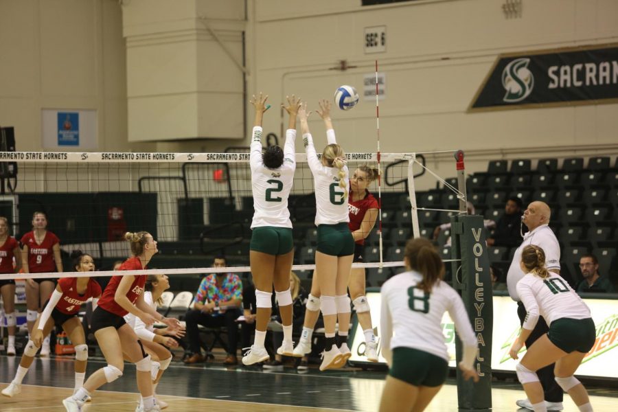 Sac State junior middle blocker Cianna Andrews (left) and freshman outside hitter Kayla Subbert barely miss blocking against Eastern Washington at The Nest. Andrews had a total of nine successful blocks during Saturdays loss.