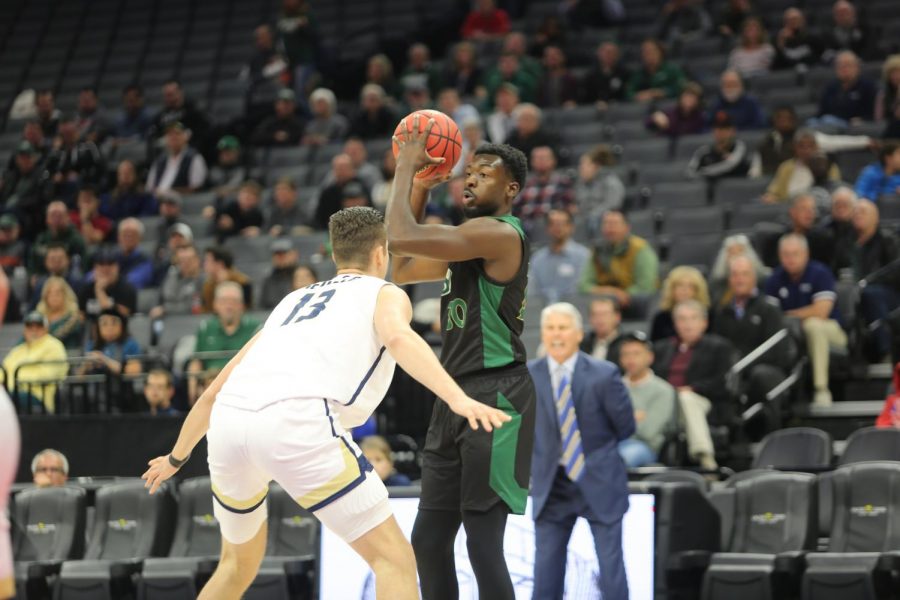 Sac State senior center Joshua Patton looks to make a pass against UC Davis senior center Matt Neufeld on Wednesday, Nov. 20 at Golden 1 Center. The Hornets defeated the Aggies 61-51 to move to 3-0 on the season.