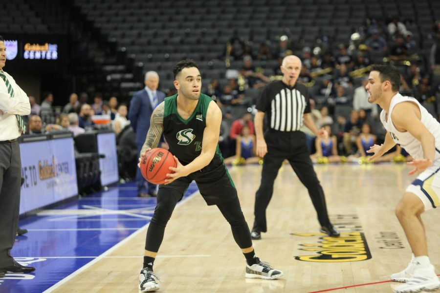 Sac State senior guard Izayah Mauriohooho-Leafa attempts to make a bounce pass against UC Davis senior guard Stefan Gonzalez on Wednesday, Nov. 20 at Golden 1 Center. Mauriohooho-Leafa had a game-high 23 points in the Hornets 77-72 win on the road at Pepperdine on Saturday night.