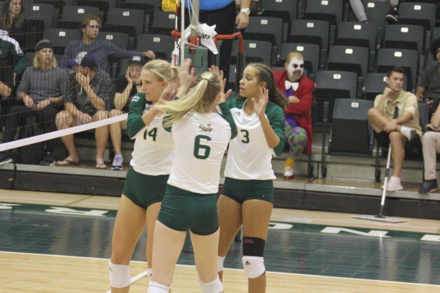 Sac State sophomore Sarah Falk, freshman Kayla Subbert, and junior Macey Hayden come together on Thursday, Oct. 31, against Idaho at The Nest. The Hornets came back from a 2-0 deficit to win the match. 