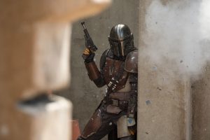 Pedro Pascals title character takes cover during a gunfight in the first episode of The Mandalorian. The series pilot was released with the launch of Disney+ Tuesday, Nov 12.