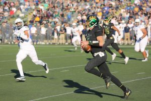 Sac State junior quarterback Kevin Thomson rushes for a first down against UC Davis on Saturday, Nov. 23 at Hornet Stadium. The No. 4 Hornets defeated the Aggies 27-17 in the 66th Causeway Classic.