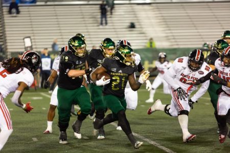 Sac State junior running back BJ Perkinson rushes for a first down against Austin Peay on Saturday, Dec. 7 at Hornet Stadium. The Hornets football team is just one of the Sac State sports' teams whose season will be postponed due to postponement of Big Sky Conference fall sports competition.
