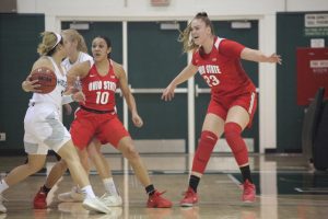 Ohio State junior guard Braxtin Miller and freshman forward Rebeka Mikulasikova guard Sac State senior guard Gabi Bade against the Hornets on Tuesday, Dec. 17 at the Nest. The Hornets were defeated by the Buckeyes 104-74.