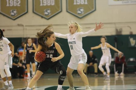 Sac State sophomore guard Summer Menke defends Montana senior guard McKenzie Johnston against the Lady Griz on Monday, Dec. 30 at the Nest. The Hornets lost to the Lady Griz 64-60.