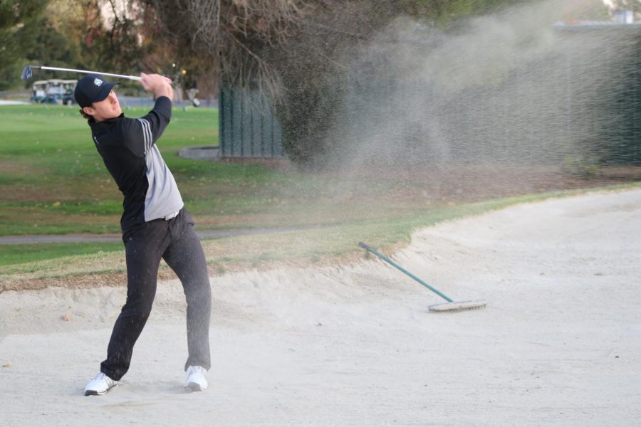 Sac State sophomore golfer Ethan Davidson works on hits out of the sand trap at Valley Hi Country Club. Davidson was named an All-Big Sky honorable mention following his freshman season.
