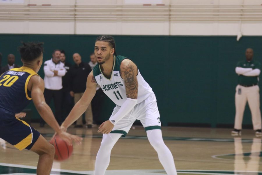 Sac State sophomore guard Brandon Davis crosses over against Northern Arizona sophomore guard Cameron Shelton versus the Lumberjacks on Thursday, Jan. 9 at the Nest. The Hornets beat Weber State 71-57 Saturday, Jan. 11.