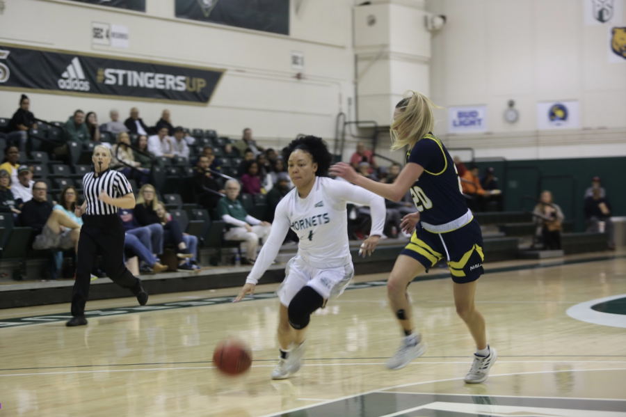 Sac State senior guard Camariah King dribbles around Northern Arizona junior guard Lauren Orndoff on Monday, Jan. 27 at the Nest. The Hornets were defeated by the Lumberjacks 85-65.