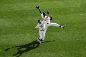 Sac State sophomore center fielder Trevor Doyle (left) and senior left fielder Matt Smith (right) both attempt to catch a fly ball against the University of Wisconsin, Milwaukee on Sunday, Feb. 23 at John Smith Field. The Hornets swept the four-game series from the Panthers.