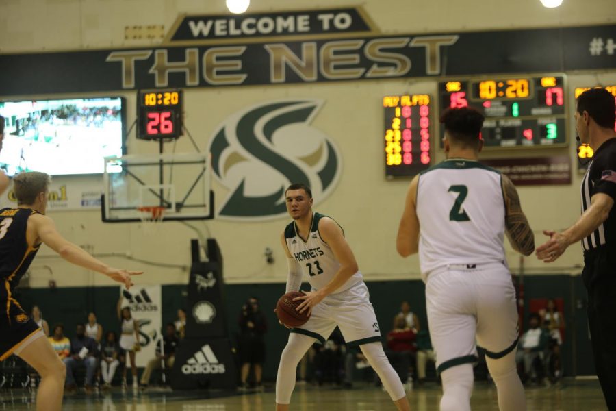 Sac State junior guard Bryce Fowler looks for a teammate in the post against Northern Colorado at the Nest on Saturday, Feb. 15.  Fowler finished with 10 points and four assists.