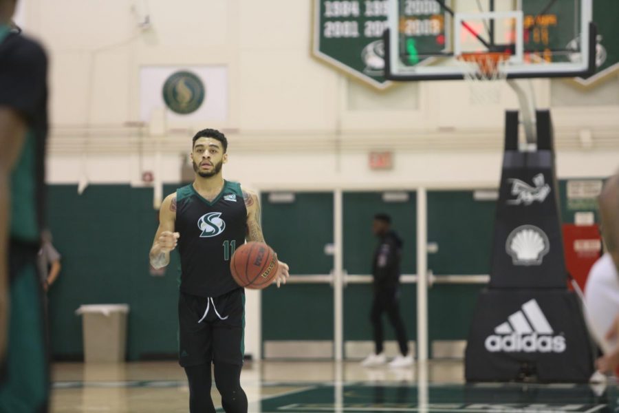 Sac State sophomore guard Brandon Davis dribbles the ball up the court against Southern Utah at the Nest Thursday, Feb. 13. Davis scored 16 points to go along with two assists. 