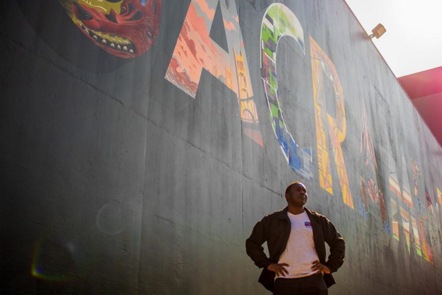 Waverly Hampton III stands in front of the Sacramento mural at Sac State on Friday, Feb. 7. Hampton is running for the Sacramento City Council District 6.
