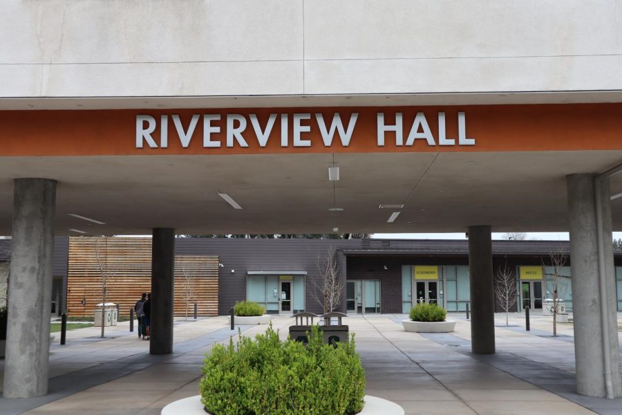 The early move-outs prompted by the coronavirus leave the Riverview Hall plaza empty aside from two people pushing a wheeled moving cart on March 18, 2020. President Nelsen said 10% of residence hall students per week will undergo random COVID-19 surveillance tests in his spring address Thursday, and Vice President of Student Affairs Ed Mills said it will be voluntary.