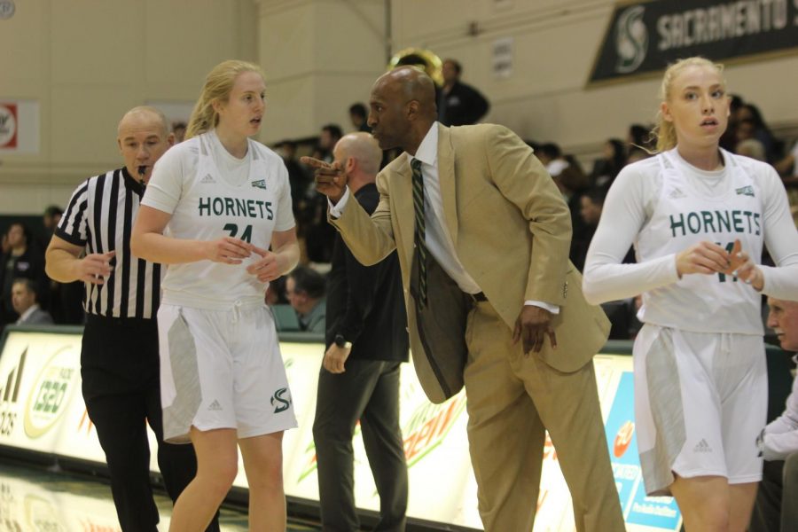 Sac State sophomore forward Tiana Johnson gets instruction from assistant coach Derrick Florence against Portland State on Friday, March 6 at the Nest. The Hornets fell to the Vikings 91-68 on Senior Night. 