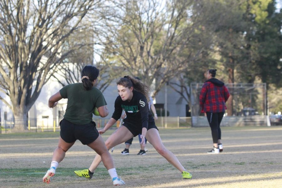 Womens rugby club president Sarah Armanino attempts to stop her teammate in a practice drill Tuesday, Feb. 25. The womens rugby club prides itself on being open to all skill levels.
