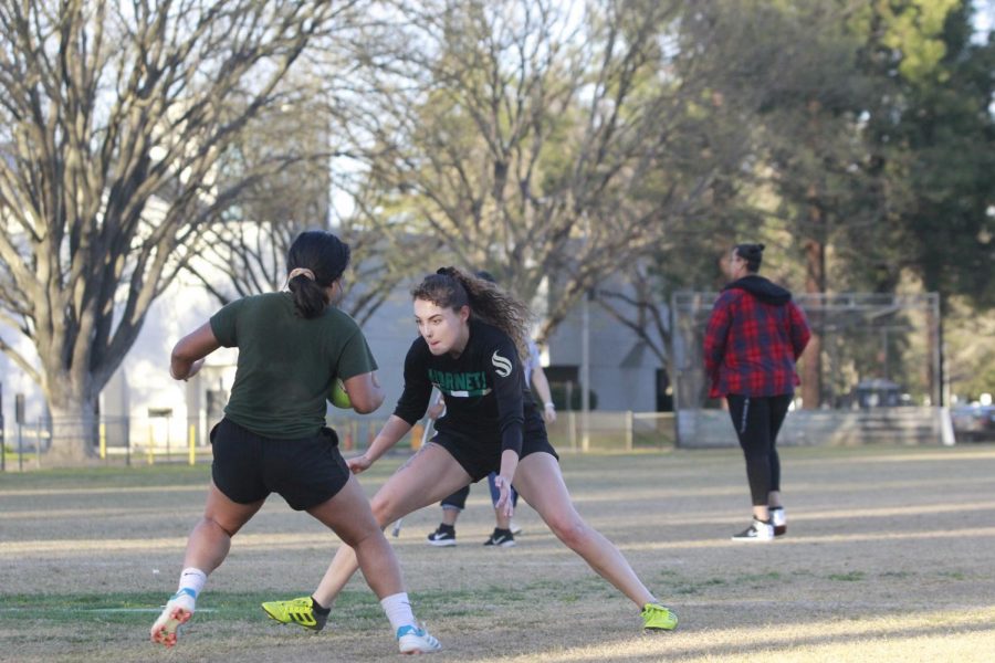 Women's rugby club president Sarah Armanino attempts to stop her teammate in a practice drill Tuesday, Feb. 25. The women's rugby club prides itself on being open to all skill levels.