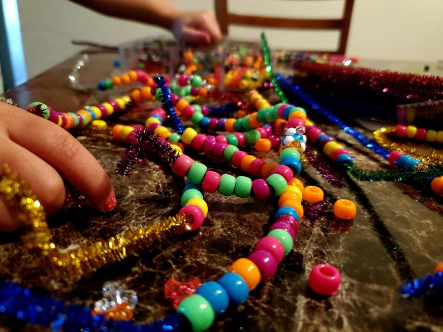 Homeade crafts are an easy way to keep your child entertained. Crafts like beads and pipe cleaners pictured above can be found at your local craft store. Photo Credit: Ashton Byers
