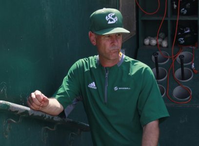 Sac State baseball coach Reggie Christiansen poses for a photo at John Smith Field. Christiansen has been relying on high school and travel ball coaches to get opinions on potential recruits.