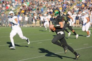 Sac State junior quarterback Kevin Thomson rushes for a first down against UC Davis on Nov. 23, 2019 at Hornet Stadium. Thomson entered the NCAA transfer portal signalling the possibility that he will leave Sac State for his final year of eligibility. 