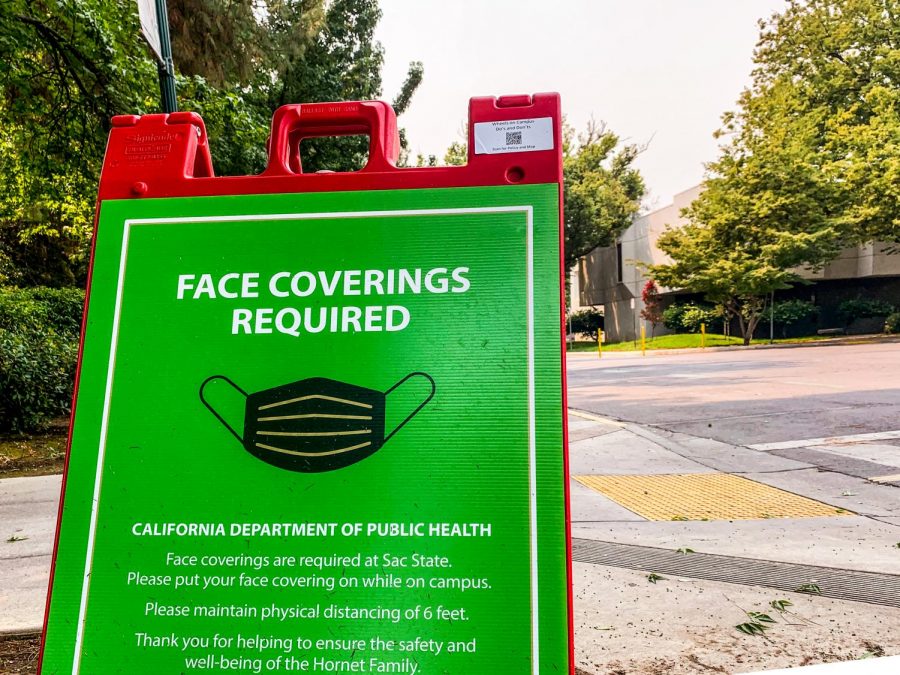 Sac State displays signs saying face coverings are required as the air quality worsens on campus Thursday, Aug. 20, 2020. The portable, foldable A frame signs are what the cyclists say they used to perform tricks in Guy West Plaza at Sacramento State on the night of June 4.