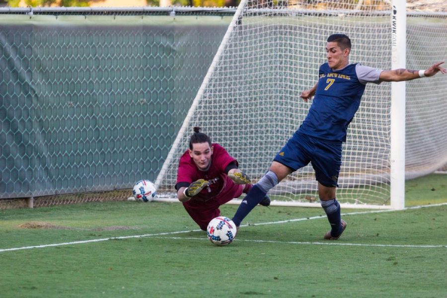 Sacramento State senior goalkeeper James Del Curto blocks a shot on goal by UC Irvine senior midfielder Giovanni Godoy Saturday, Sept. 30, 2017 at Hornet Field. 