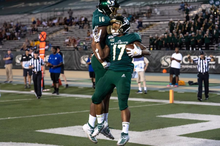 Sac State wide receiver Dewey Cotton, right, and tight end Marshel Martin, left, celebrate after Cotton scored a touchdown against Northern Colorado on Saturday, Sept.14, 2019 at Hornet Stadium. Cotton had a total of 14 yards receiving and one touchdown against the Bears.