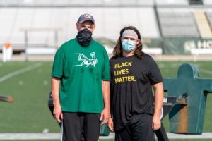 Kris (left) and Kaden (right) Richardson pose at Hornet Stadium after football practice on Thursday, Sept. 17th. Masks have been made mandatory for athletes and staff on the field.  