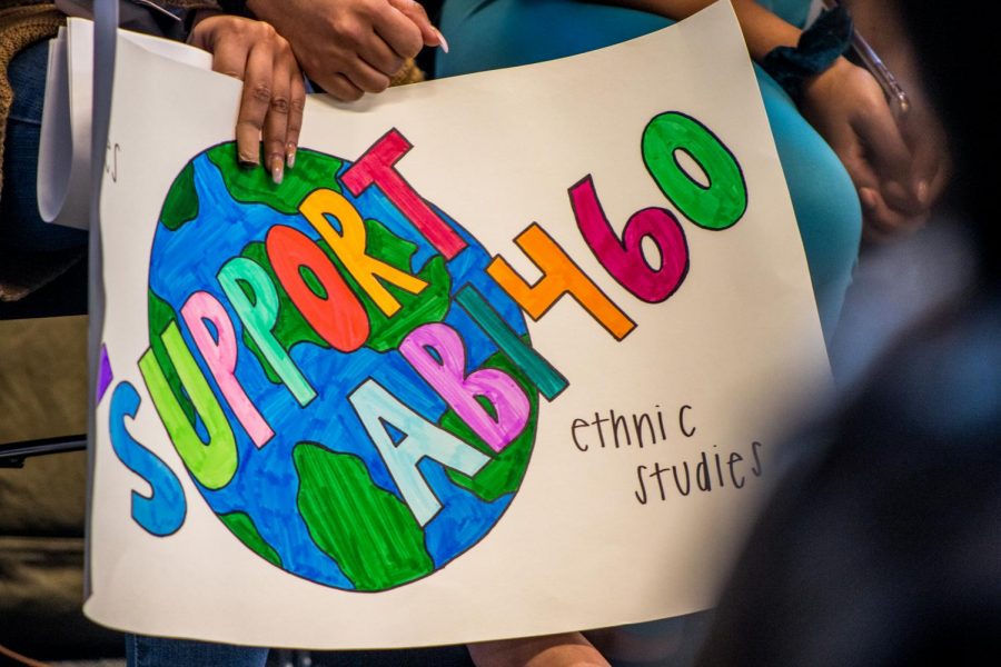 A demonstrator holds a sign advocating for AB 1460 in the University Union at a Faculty Senate meeting Thursday, Feb. 27, 2020. Sacramento State's Faculty Senate discussed the ethnic studies department’s resolution in opposition to the CSU Chancellor’s Office’s proposed implementation of the bill. 