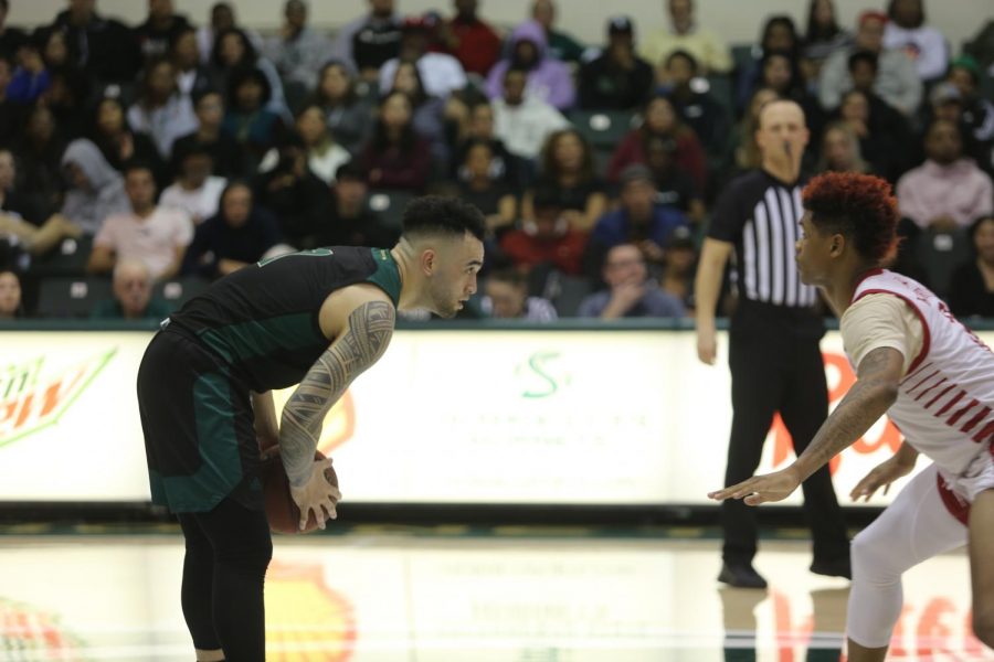 Former guard Izayah Mauriohooho-Leafa scans the floor against Southern Utah at the Nest on Thursday, Feb. 13