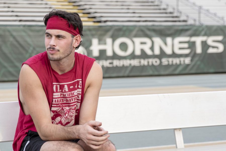 Sam Clark, environmental science major, poses on the bench after practice at Hornets Stadium at Sacramento State Tuesday, Oct. 6, 2020. Clark started playing football March 2018 in Australia and came to Sacramento June 2019 to play for Sac State. 