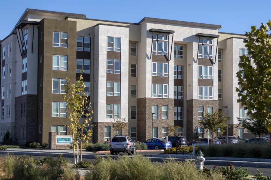 A car pulls into The Crossings apartment complex on Ramona Avenue in Sacramento, California, Monday, Oct. 26, 2020. Sacramento PD were notified of a bomb threat against The Crossings at 1:40 p.m., and nothing was found, according to Officer Karl Chan.