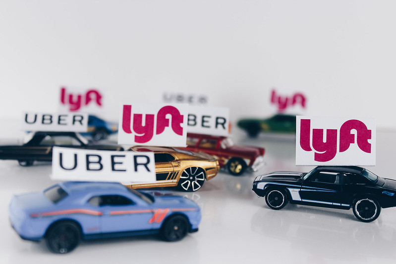 Ride-hailing services include app-based bookings for private cars or taxis like Uber and Lyft. Proposition 22 would make app-based drivers for ride-hailing and delivery companies independent contractors instead of employees. "ride sharing uber lyft" by stockcatalog is licensed under CC BY 2.0