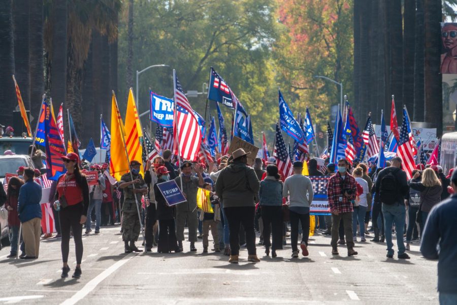 Trump supporters gather on Saturday, Nov. 14th, 2020 along 10th Street in front of the California State Capitol in response to Joe Biden’s projected election victory. South Korean flags could be seen alongside 'Trump 2020' and American flags.