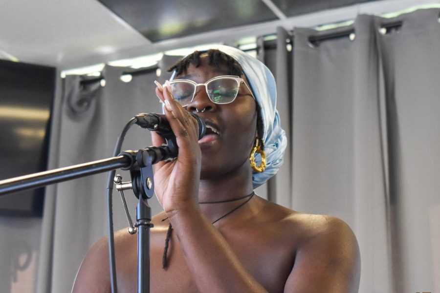 Greo the lead vocalist sings with BAOBAB at Eminent DoMane Barbers Lounge & Podcast Studio in Sacramento, California, Tuesday, Dec. 8, 2020. The band participated in The State Hornets third installment of Stinger Sound Sessions. 